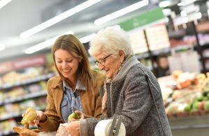 Elderly woman with young woman at the grocery store